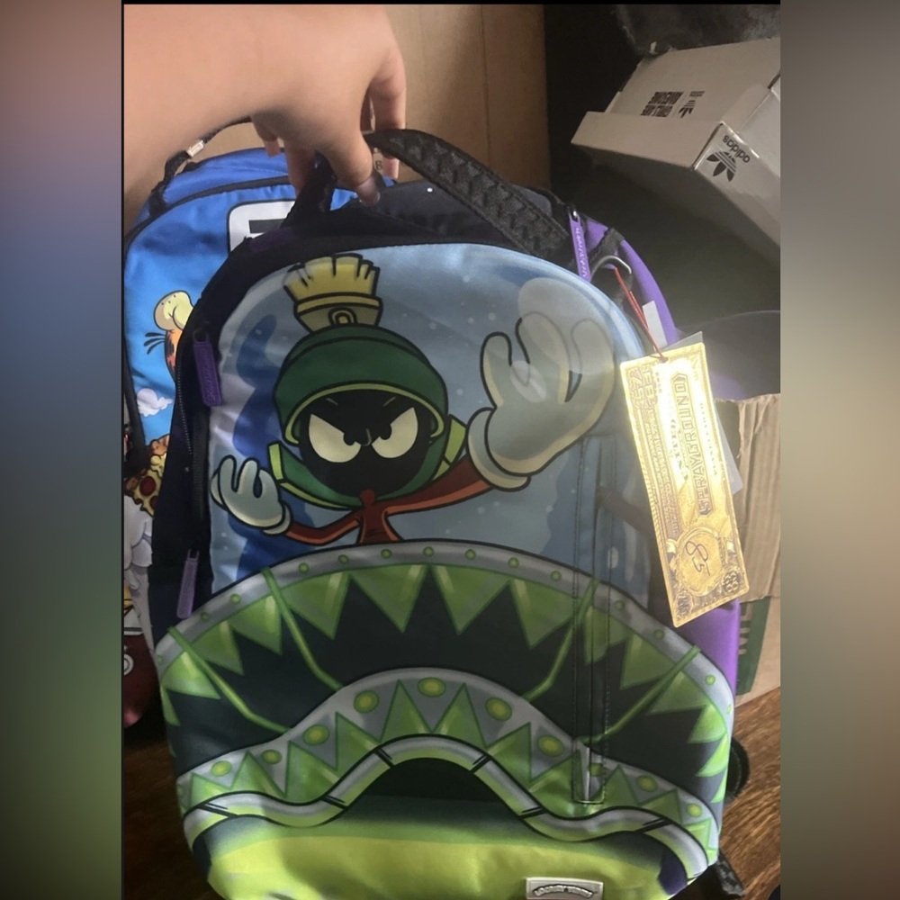 Sprayground Black and Green Backpack with Red Logo